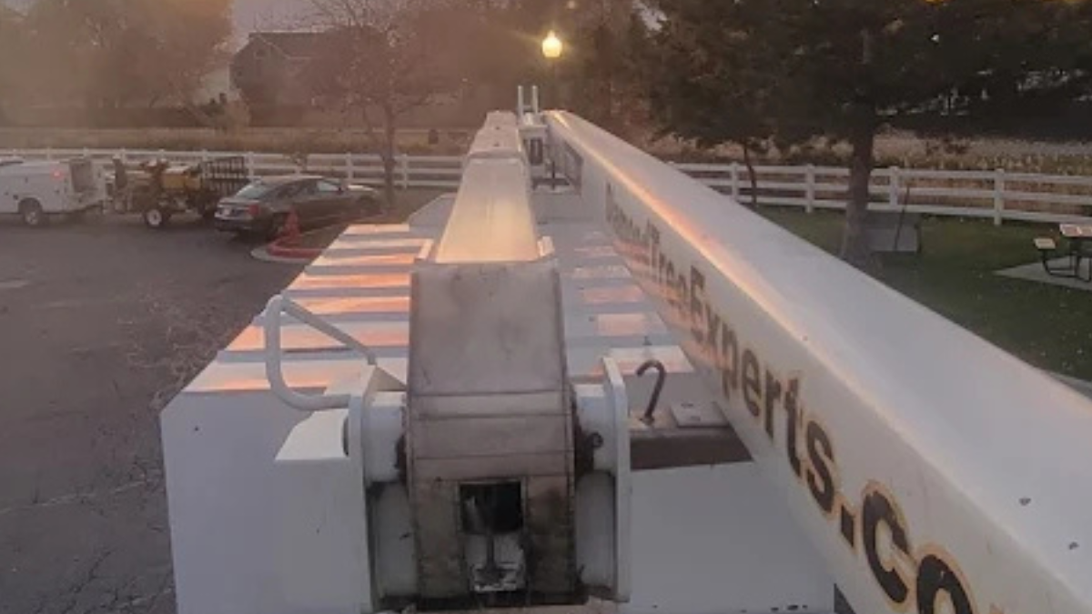 Diamond Tree Experts’ professional boom truck and equipment prepared for tree removal and trimming work in Salt Lake City, Utah, during early morning setup.